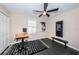 Home office features built-in desk, flooring, and ceiling fan at 12610 Rangeland Blvd, Odessa, FL 33556