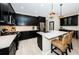 Modern kitchen with island, stainless steel appliances, and wine cooler at 12610 Rangeland Blvd, Odessa, FL 33556