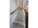 Stylish staircase with wood railings and modern flooring at 12610 Rangeland Blvd, Odessa, FL 33556