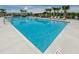Relaxing community pool with shaded seating and lounge chairs at 12610 Rangeland Blvd, Odessa, FL 33556