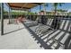 Relaxing pool area with shaded lounge chairs and tables at 12610 Rangeland Blvd, Odessa, FL 33556