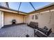 Cozy back patio with seating and grill at 12610 Rangeland Blvd, Odessa, FL 33556
