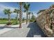 Community entrance with palm trees and stone wall at 12610 Rangeland Blvd, Odessa, FL 33556