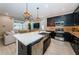 Spacious kitchen with a large island, stainless steel appliances and breakfast bar at 12610 Rangeland Blvd, Odessa, FL 33556