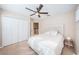 Bedroom with queen bed, ceiling fan, and double door closet at 12610 Rangeland Blvd, Odessa, FL 33556