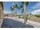 Resort-style pool with palm trees and a relaxing patio area at 12610 Rangeland Blvd, Odessa, FL 33556