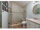 Clean bathroom with a walk-in shower, toilet, and vanity at 7400 14Th Ne St, St Petersburg, FL 33702