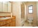 Full bathroom with shower/tub combo, toilet and sink at 904 Bayshore Dr, Terra Ceia, FL 34250