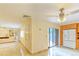 Living area with tile floors and access to patio at 707 1St Ct, Palm Harbor, FL 34684