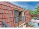 Private balcony with a red tile roof and a view of the parking lot at 707 1St Ct, Palm Harbor, FL 34684