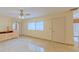 Bright living room with tile floors and access to kitchen at 707 1St Ct, Palm Harbor, FL 34684