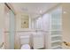 Bathroom with toilet, shower, and built-in shelving at 707 1St Ct, Palm Harbor, FL 34684