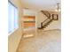 Bright living area with tile floors and a view of the kitchen at 707 1St Ct, Palm Harbor, FL 34684