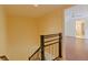Modern staircase with metal railing leading to upper level at 707 1St Ct, Palm Harbor, FL 34684