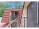Condo exterior showcasing Spanish tile roof and balcony at 707 1St Ct, Palm Harbor, FL 34684
