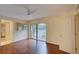 Bright bedroom with wood floors and access to a balcony at 707 1St Ct, Palm Harbor, FL 34684