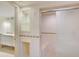 Bathroom with shower and built-in shelving at 707 1St Ct, Palm Harbor, FL 34684