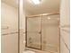 Clean bathroom with a shower/tub combo and tile surround at 707 1St Ct, Palm Harbor, FL 34684