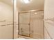 Bathroom with shower/tub combo and tiled walls at 707 1St Ct, Palm Harbor, FL 34684