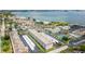 Beautiful aerial view of community with tennis courts, beachfront, parking and colorful surrounding neighborhood at 3128 59Th S St # 214, Gulfport, FL 33707