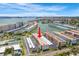 Scenic aerial view of a condo complex, highlighting the building's location with a prominent red arrow at 3128 59Th S St # 214, Gulfport, FL 33707
