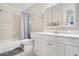 Clean bathroom with a shower-tub combo, toilet, and single vanity with ample storage at 3128 59Th S St # 214, Gulfport, FL 33707
