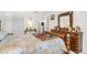 Comfortable bedroom showcases a beautiful bed, wooden furniture, and bright natural light at 3128 59Th S St # 214, Gulfport, FL 33707