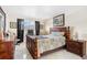 A well-lit bedroom features a comfortable bed, classic furnishings, and bright window at 3128 59Th S St # 214, Gulfport, FL 33707