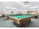 Large billiard room with multiple pool tables, providing a recreational space for residents at 3128 59Th S St # 214, Gulfport, FL 33707