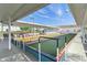 Bocce ball court with covered seating and shade with lush landscaping and signage at 3128 59Th S St # 214, Gulfport, FL 33707
