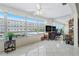 Bright bonus room with scenic views, tile flooring, and a mirrored wall reflecting the outside at 3128 59Th S St # 214, Gulfport, FL 33707