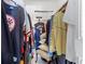 Organized closet with various clothing items and accessories neatly arranged on hangers and shelves at 3128 59Th S St # 214, Gulfport, FL 33707