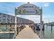 Sign for South Dock at Town Shores of Gulfport with boats and multi-story waterfront condo buildings at 3128 59Th S St # 214, Gulfport, FL 33707