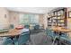 Game room with tables, chairs, puzzles and board games for social gatherings at 3128 59Th S St # 214, Gulfport, FL 33707
