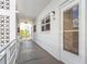 Inviting outdoor hallway of building featuring unit 214, enhanced by natural light and architectural details at 3128 59Th S St # 214, Gulfport, FL 33707
