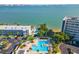 Aerial view of the pool area with lounge chairs and views of the bay at 3128 59Th S St # 214, Gulfport, FL 33707