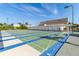 Outdoor shuffleboard court with covered seating and shade and lush landscaping at 3128 59Th S St # 214, Gulfport, FL 33707