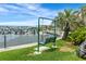 Relaxing waterfront view featuring a swing and lush greenery, creating a tranquil and inviting atmosphere at 3128 59Th S St # 214, Gulfport, FL 33707