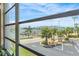 Captivating water view from window, with nearby boat dock, palm trees and clear blue sky, enhanced by natural light at 3128 59Th S St # 214, Gulfport, FL 33707