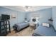 Second bedroom with twin beds and calming decor at 175 116Th Ave # 102, Treasure Island, FL 33706