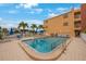 Refreshing community pool with patio furniture at 175 116Th Ave # 102, Treasure Island, FL 33706