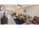 Relaxing living room with comfortable seating and view to dining area at 175 116Th Ave # 102, Treasure Island, FL 33706