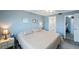 Main bedroom with king-size bed and access to bathroom at 175 116Th Ave # 102, Treasure Island, FL 33706
