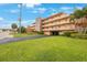 Two-story building with parking and grassy area at 175 116Th Ave # 102, Treasure Island, FL 33706