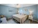 Spacious main bedroom with king-size bed and calming decor at 175 116Th Ave # 102, Treasure Island, FL 33706
