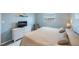 Guest bedroom with twin beds, suitable as a home office at 175 116Th Ave # 102, Treasure Island, FL 33706