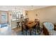 Cozy dining area with wood table and chairs near kitchen at 175 116Th Ave # 102, Treasure Island, FL 33706