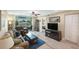 Open living area with comfortable seating and views of the balcony at 175 116Th Ave # 102, Treasure Island, FL 33706