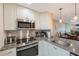 Updated kitchen with stainless steel appliances and granite countertops at 175 116Th Ave # 102, Treasure Island, FL 33706