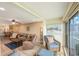Sunroom with wicker furniture and water views at 175 116Th Ave # 102, Treasure Island, FL 33706